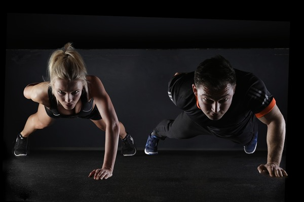 man and woman exercising