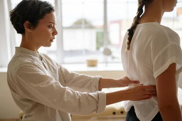 physiotherapist treating back pain
