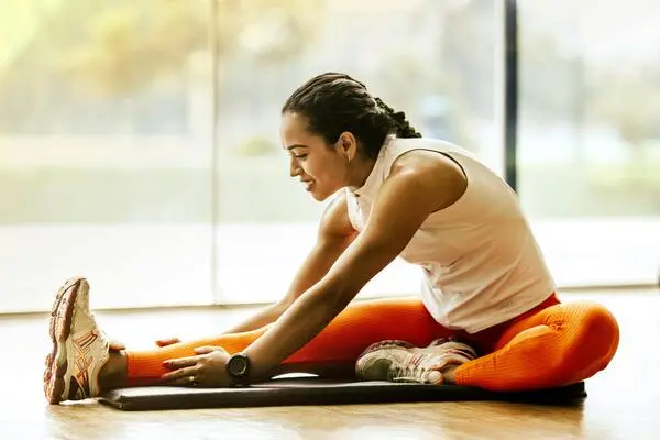 woman doing leg stretching exercise