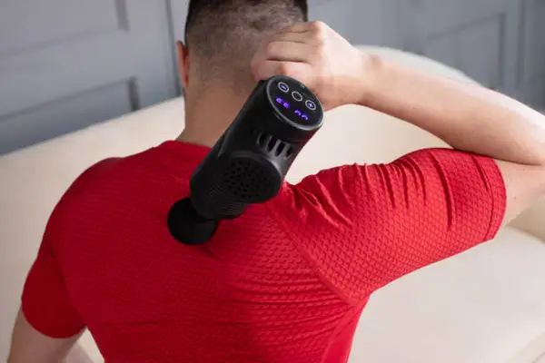 massage gun on neck pain